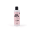 Flacon rose de "Bra Tape Remover" avec bouchon noir sur fond blanc, format 300 ml. Mode Grande taille