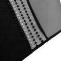 Gros plan de la Culotte Maltilda noir en dentelle et maille d'Elomi mettant en valeur des détails à pois et des bords festonnés. Mode Grande taille