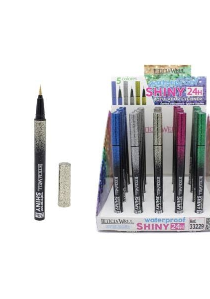 Présentoir d'eyeliners waterproof pailletés de différentes couleurs, avec un stylo décapuchonné et posé à côté de la boîte. Mode Grande taille