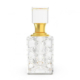 Collection Musc Al Quraishi Crystal El Nabil : un flacon de parfum en verre transparent avec un col doré et un corps carré et décoratif présenté sur un fond blanc. Mode Grande taille