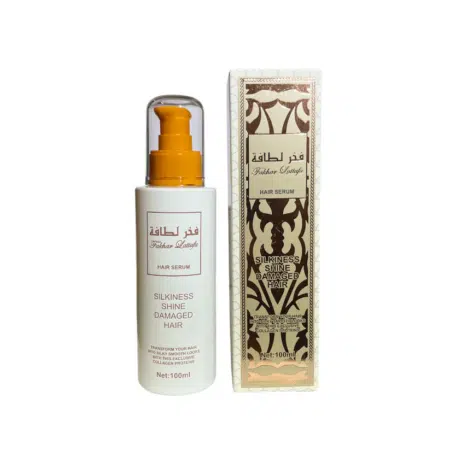 Un flacon et une boîte de Sérum cheveux parfumé - Fakhar Lattafa, présentant un design doré et blanc et étiqueté pour des cheveux soyeux, brillants et abîmés. Mode Grande taille