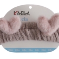 Un bandeau Bonnet Serviette Cheveux Ultra-Absorbant rose avec deux oreilles de lapin douces, attaché à un emballage blanc. Mode Grande taille
