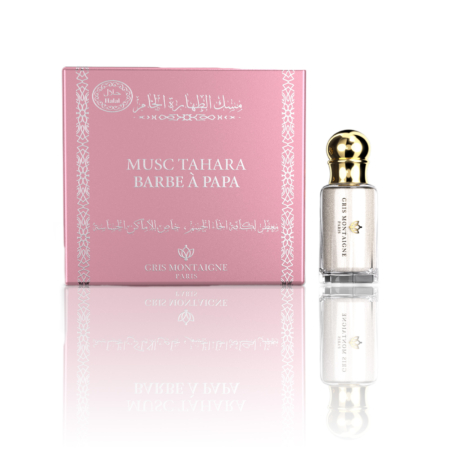 Une boîte rose étiquetée "Musc Tahara Barbe à Papa" est posée à côté d'un petit flacon en verre de la même fragrance, surmonté d'un bouchon doré. Mode Grande taille