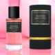 Un flacon et une boîte de parfum Parfum Marshmallow Collection Privée sur fond rose. Mode Grande taille