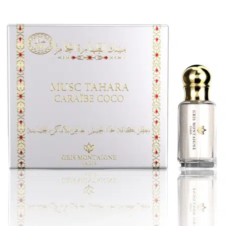 Un flacon de parfum Musc Tahara Caraïbes Coco Gris Montaigne présenté à côté de sa boîte blanche décorative. Mode Grande taille