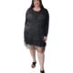 Robe noire grande taille en tulle à pois argentés pailletés, manches longues, portée par une femme ronde, vue de face